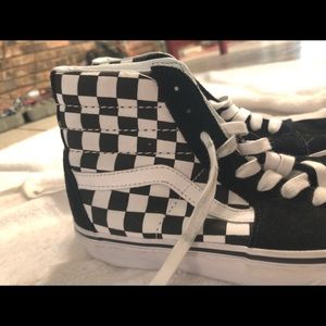 Checkered high top Vans.
